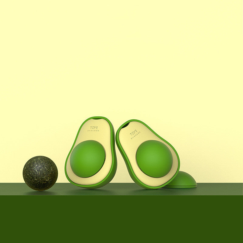 Cat playing with avocado catnip toy